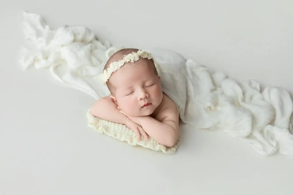adorable newborn sleeping peacefully in studio