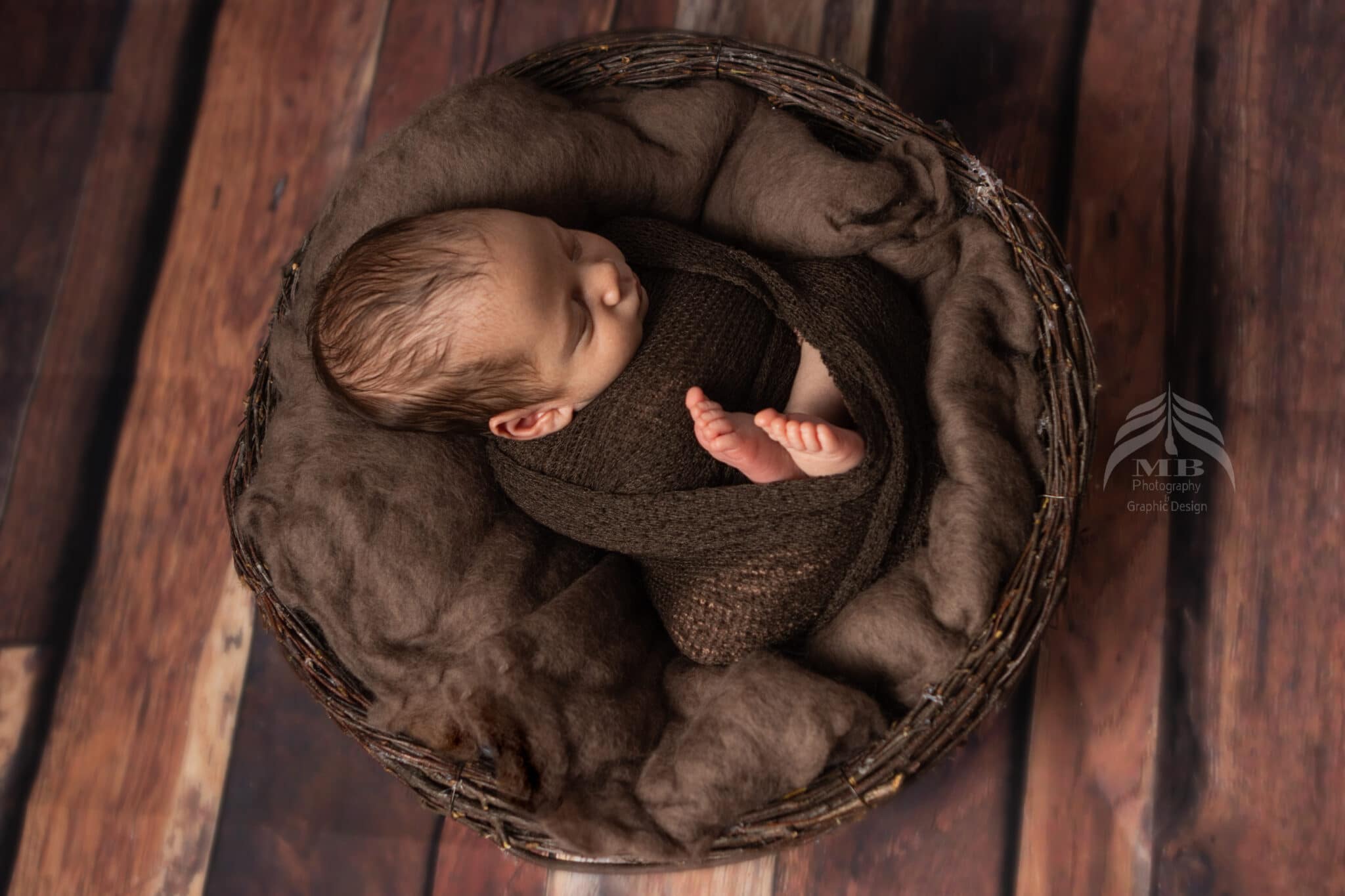 windsor ontario newborn baby brown basket overhead portrait Mariam Cheaitou Bazzi