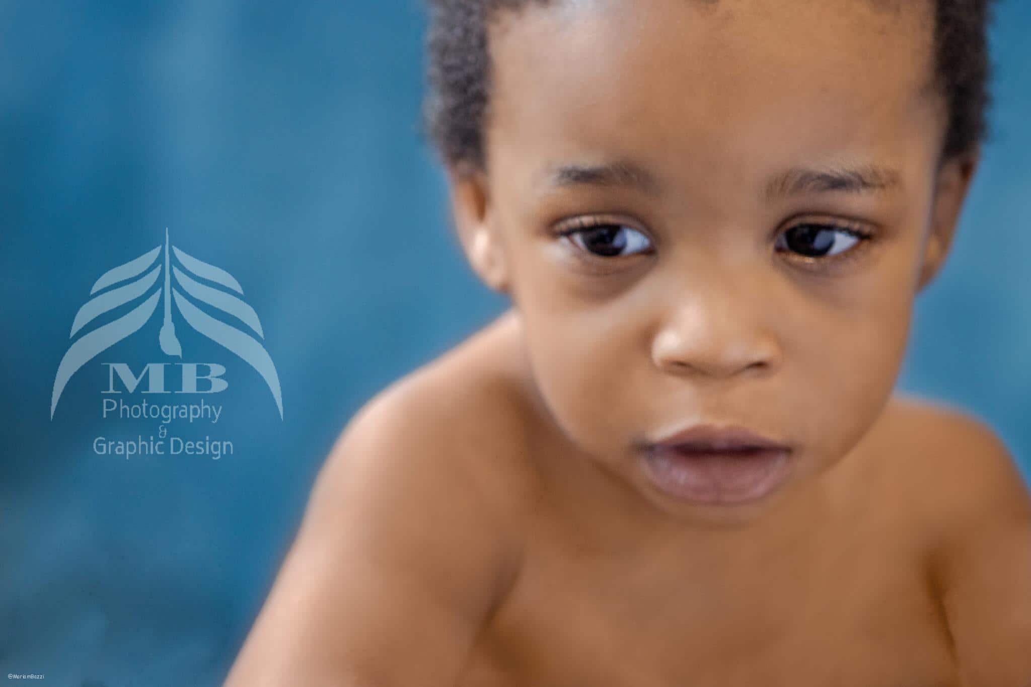 Photography Portfolio 48 Mariam Cheaitou Bazzi Photography Portfolio in Windsor Candid close-up of a baby boy looking downward during a softly styled milestone photography session in Windsor, Ontario.