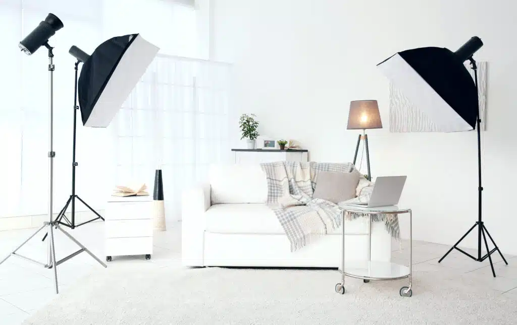 Modern photo studio interior with professional lighting equipment.