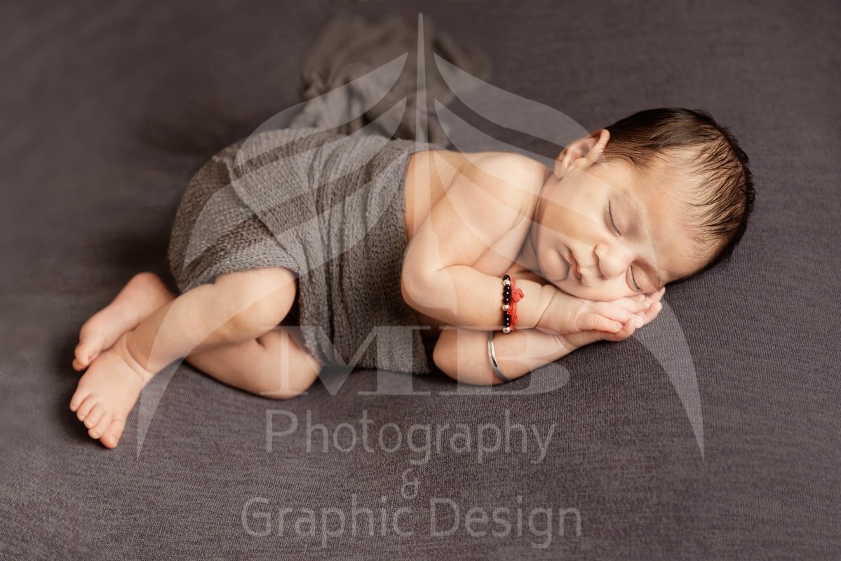 windsor ontario newborn photographer newborn hands folded sleeping pose Mariam Cheaitou Bazzi