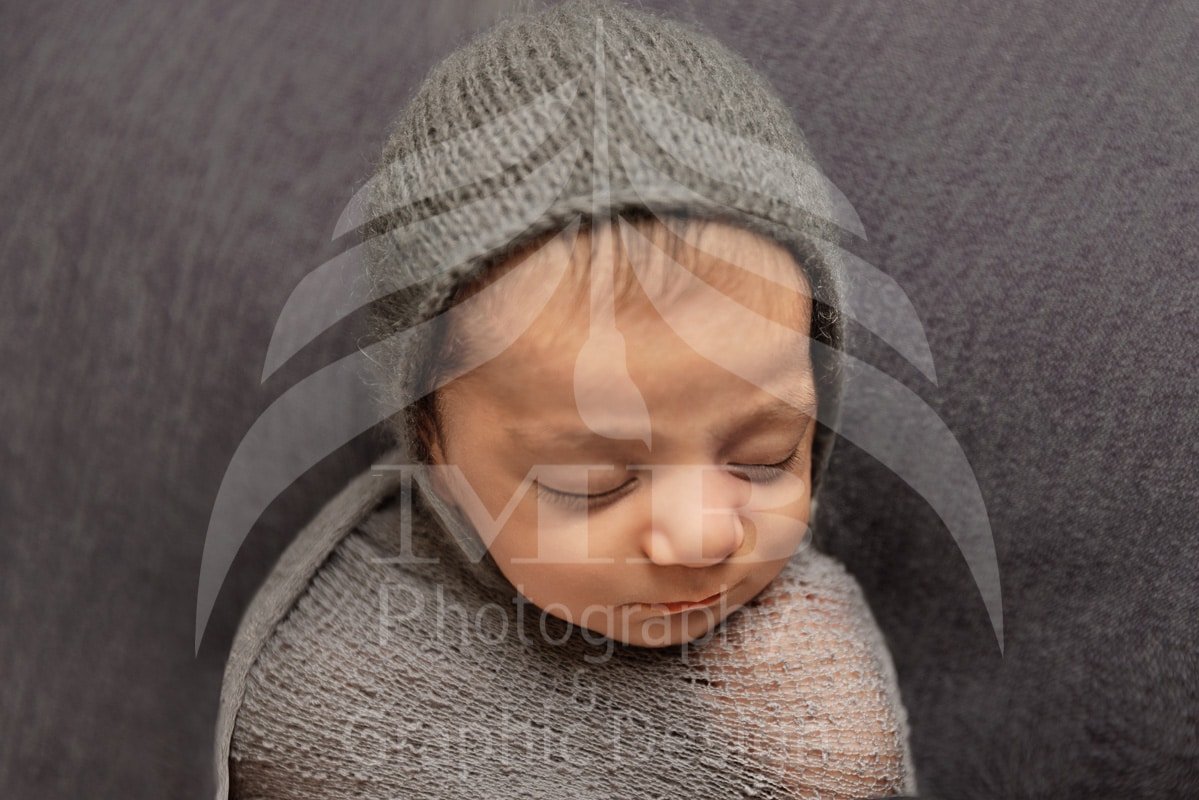 windsor ontario newborn photographer swaddled newborn bonnet close up Mariam Cheaitou Bazzi
